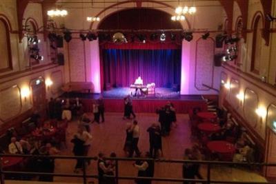 People dancing in the auditorium